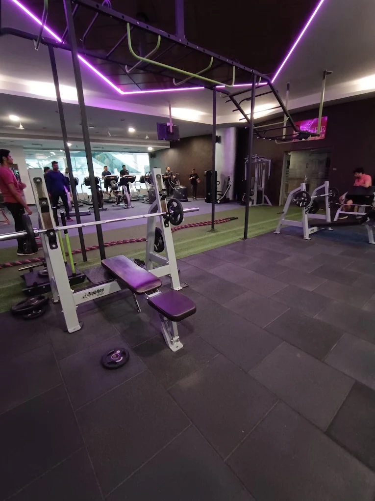 Bench press and functional training equipment at Divine Fitness Club